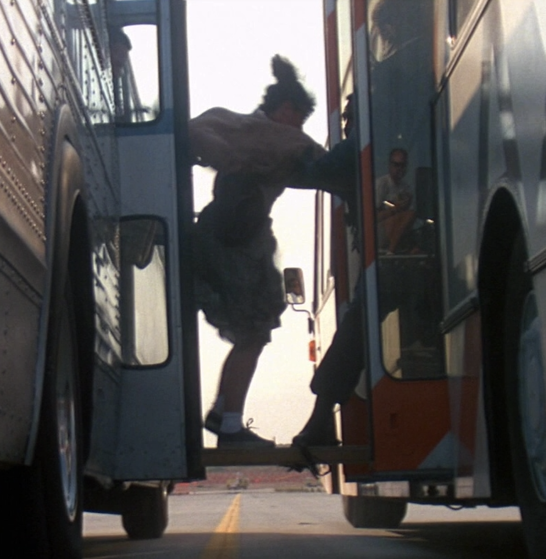 The actors on the bus performed the transfer stunt themselves. (Notice the crew reflected in the door window. Oops!)